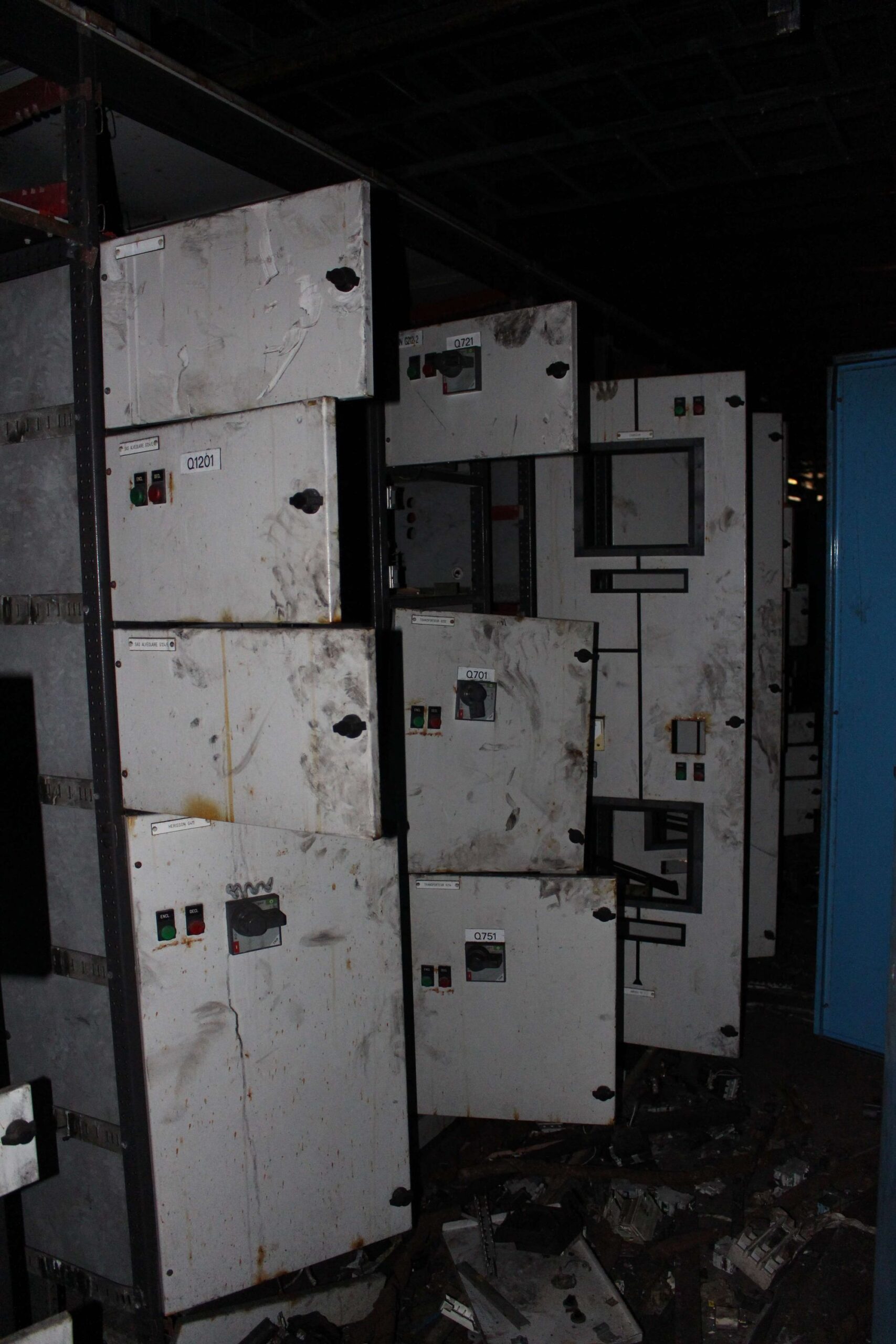 a photograph of the electrical network in a former steel factory, the photo shows many fuse boxes and buttons