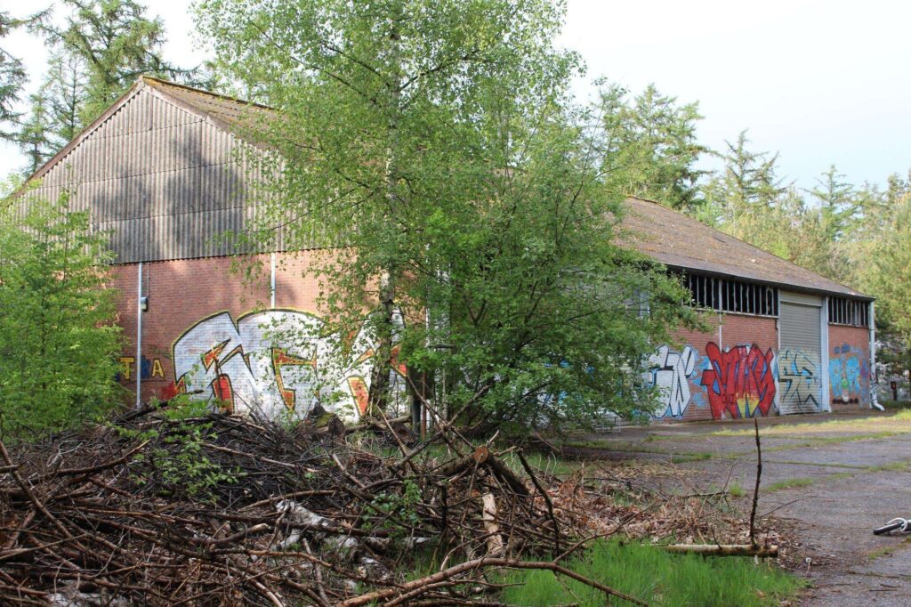 a photograph of an abandoned warehouse located in a military base