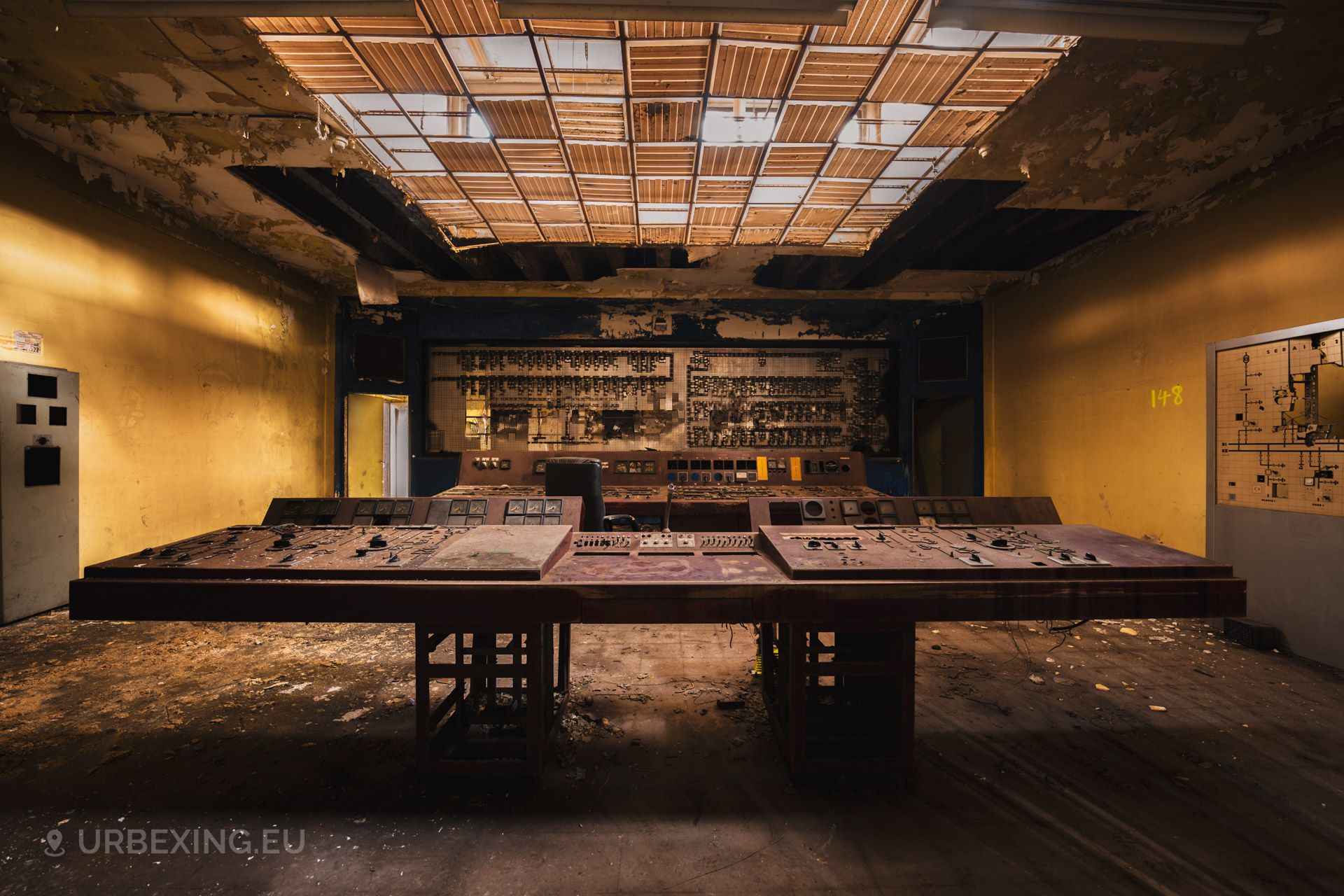 a photograph taken inside of a former steel producing factory owned by the Akers company. the photo shows many gauges and buttons.