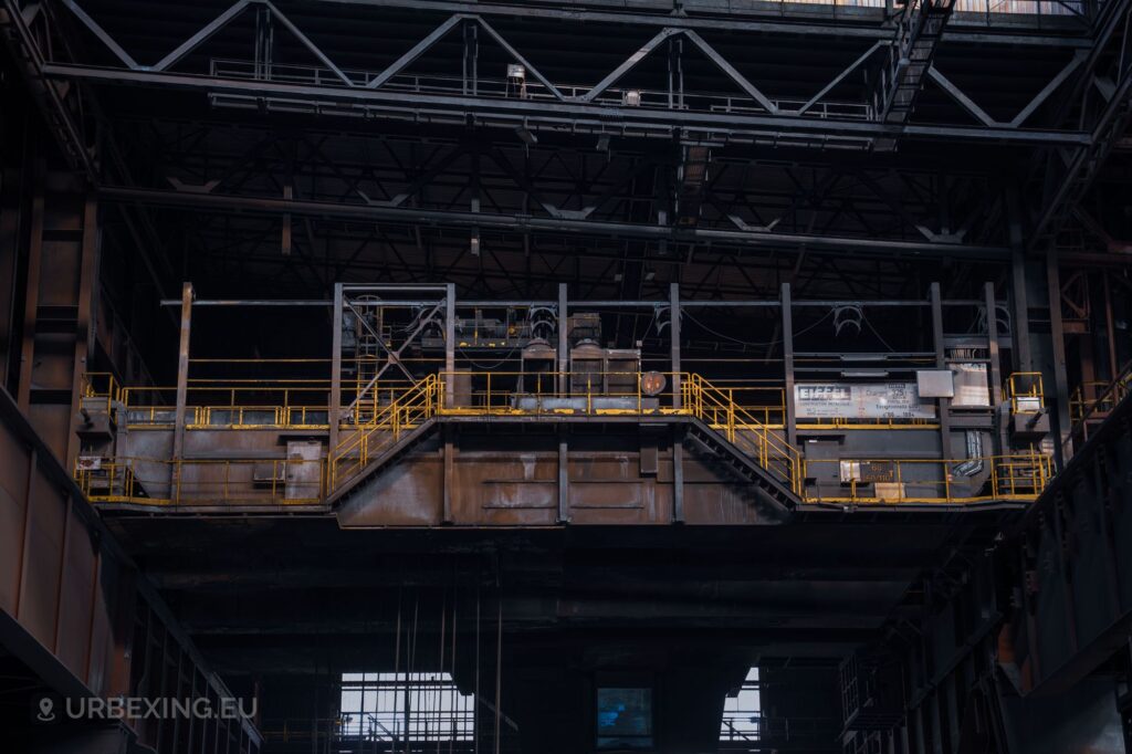 a photograph of the cabin of an industrial grade crane located in the continuous casting part of the liege steelworks