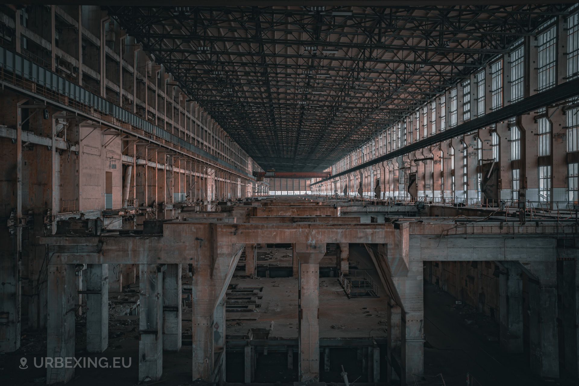 a photo of the empty turbine hall inside a former power plant; the name of the power plant is kraftwerk b
