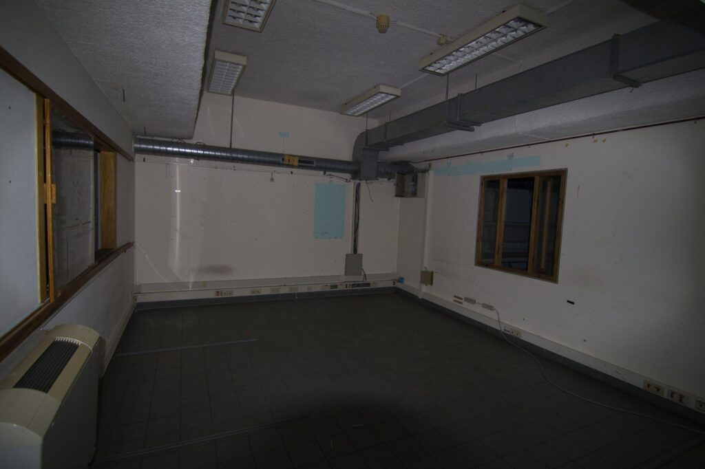 a photograph of an empty room in a bunker