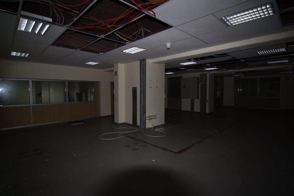a photograph of the main room in an abandoned communications and reporting centre