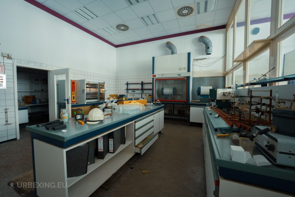 A labaratory at an abandoned power plant. The labaratory contains several science related items such as beakers, gas valves and machinery