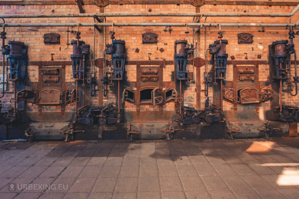 a photograph of the furnaces in a boiler house at an abandoned power plant