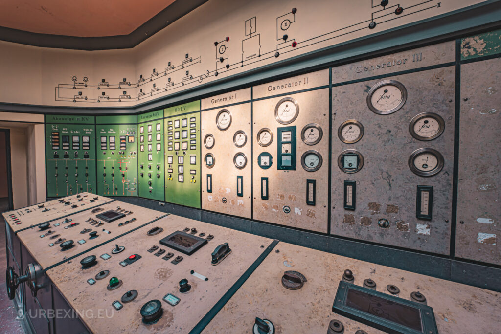a photograph of the detailed control room in the former plessa power plant. the panel is illuminated by the rays of the sun