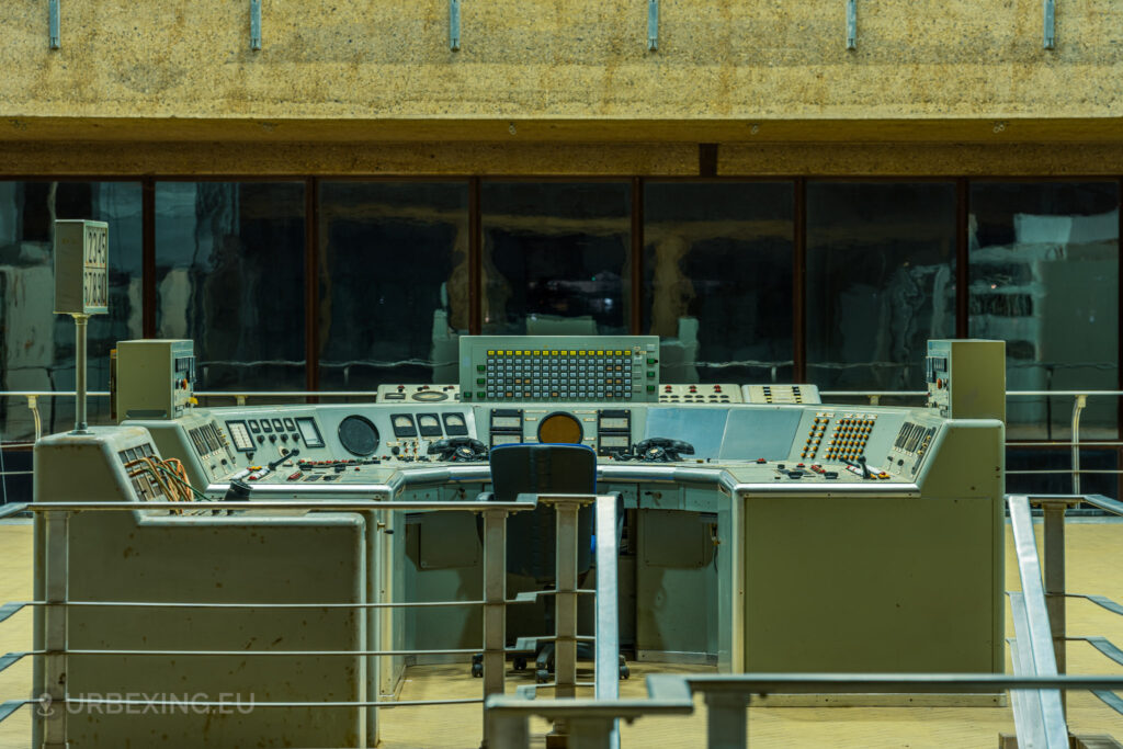 An elevated view of the main control room in "Lost Frequencies." The image shows the control desks, industrial design, and large windows that characterize this abandoned radio transmitting facility. This shot encapsulates the appeal of urban exploring in a preserved industrial environment.