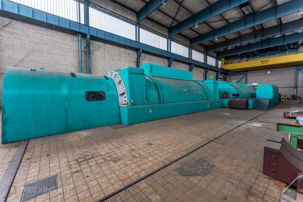 Close-up side view of a turquoise BBC generator in the abandoned Kraftwerk Voerde power station, Voerde, Germany.