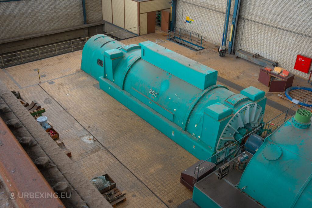 Detailed view of a turquoise BBC generator in the abandoned Kraftwerk Voerde power station, Voerde, Germany.