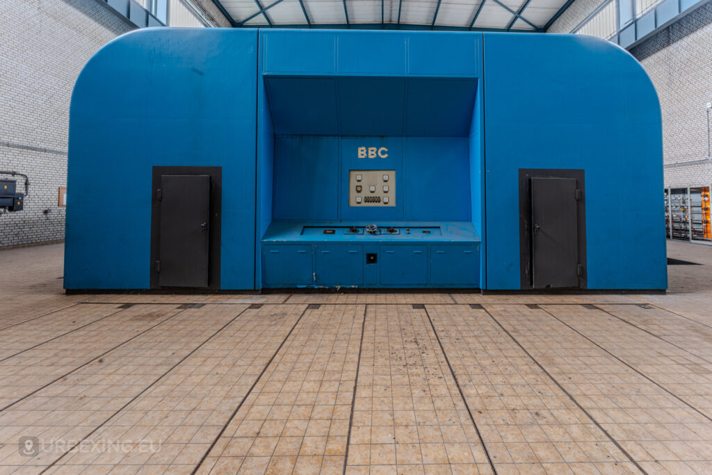 Front view of a blue BBC generator unit in the turbine hall of the abandoned Kraftwerk Voerde, Voerde, Germany.