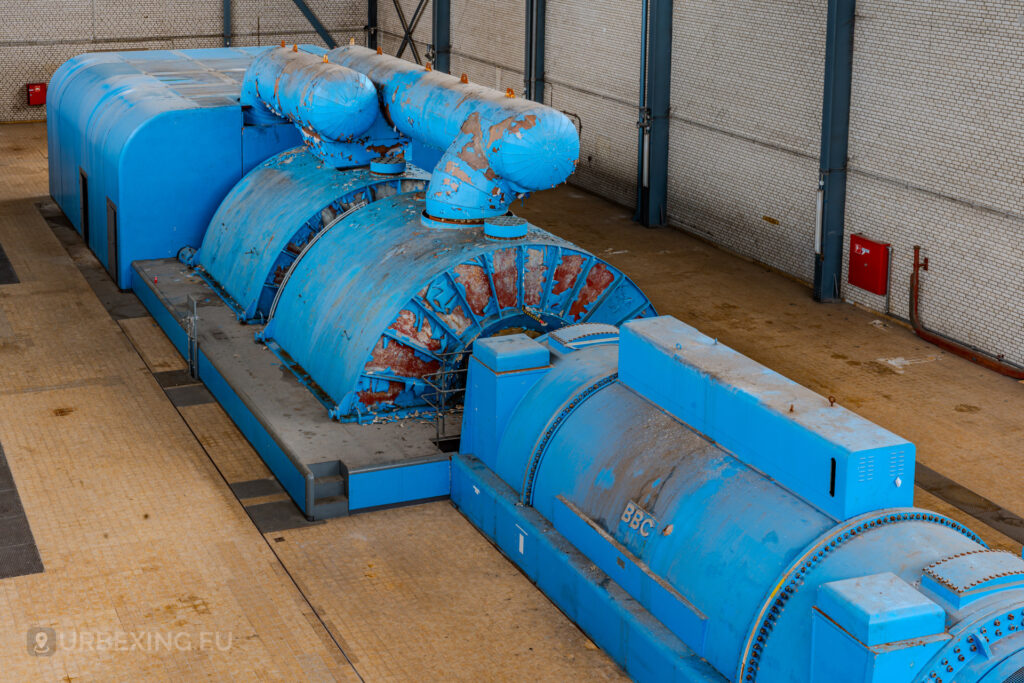 Overhead view of blue BBC turbines with peeling paint in the abandoned Kraftwerk Voerde, Voerde, Germany.