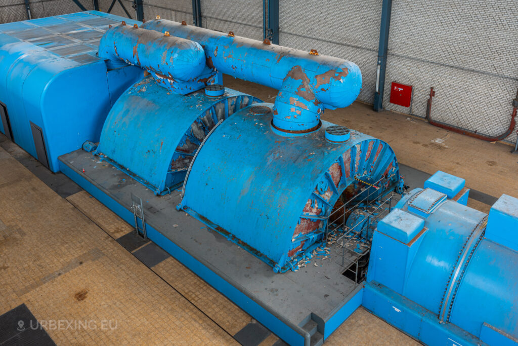 Overhead view of two blue turbine units with peeling paint in the abandoned Kraftwerk Voerde, Voerde, Germany.