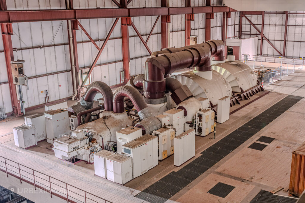 Overhead view of red and white turbines in the turbine hall of the abandoned Kraftwerk Voerde, Voerde, Germany