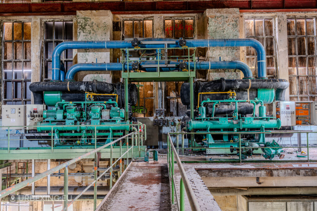 Pipes and compressors inside abandoned Bergwerk Niederberg